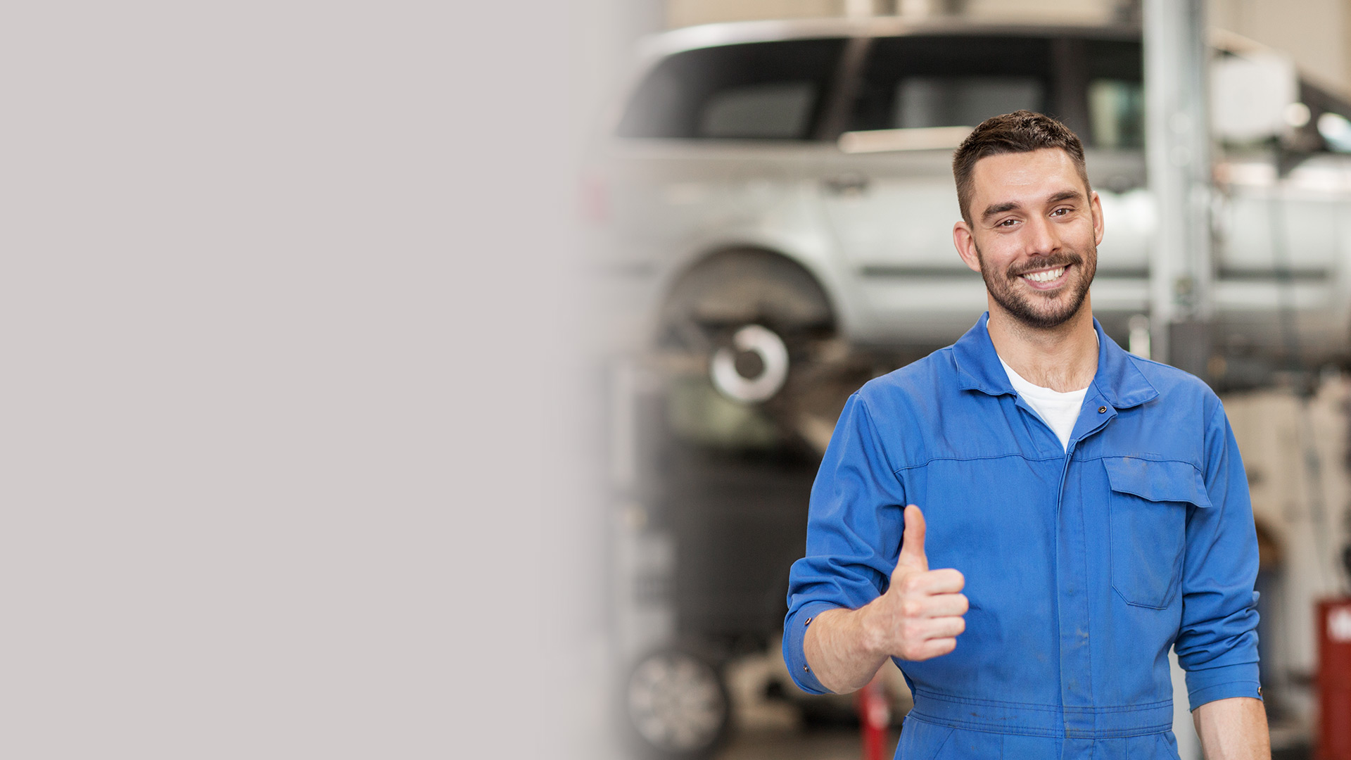 Mechanic with a thumbs up gesture