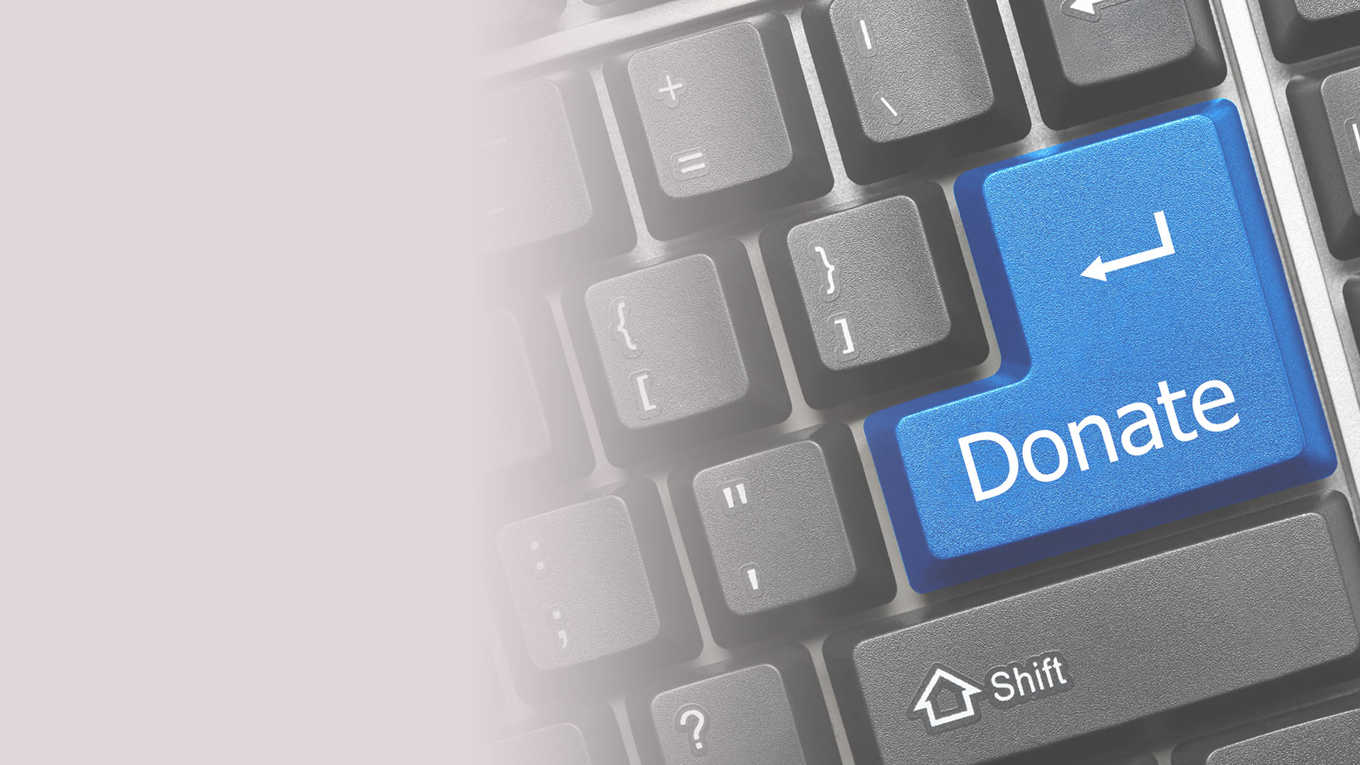 Computer keyboard with donate button