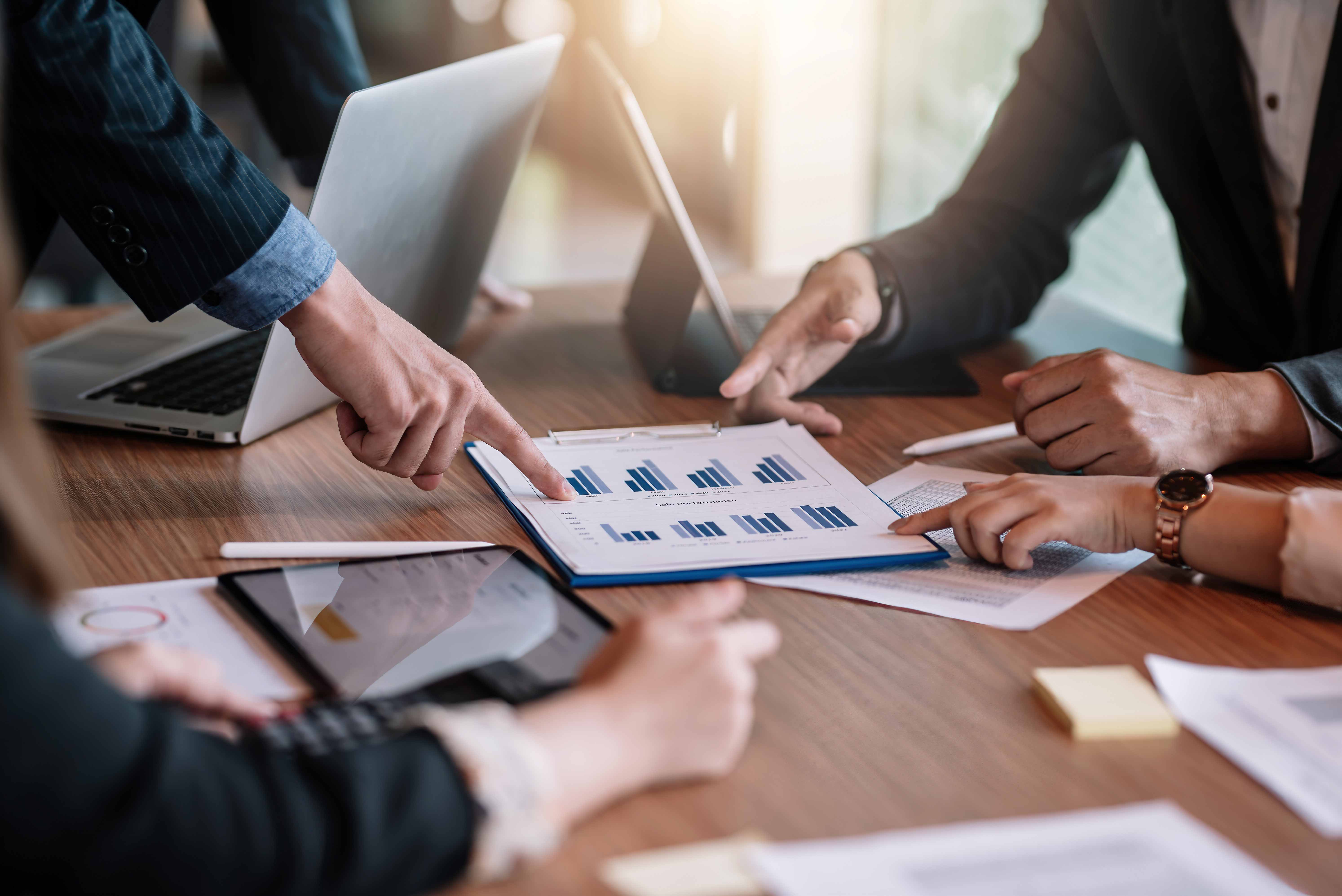 Group of people reviewing statistics